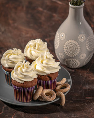 chocolate cupcakes with crackers on a plate