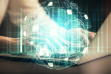 Double exposure of woman hands typing on computer and social network theme hologram drawing. People media concept.