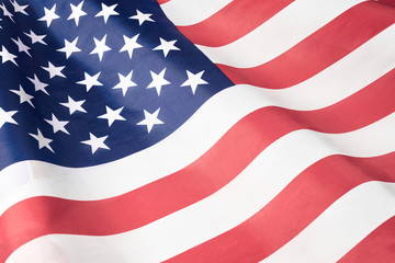 Close up of ruffled American flag. Satin texture curved flag of USA. Memorial Day or 4th of July....