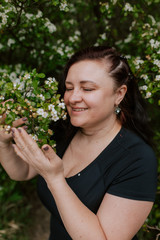 A woman walks in nature in the summer.