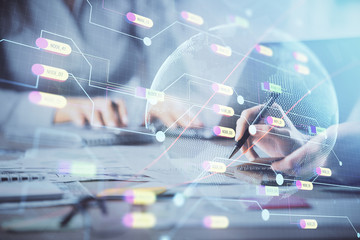 Double exposure of woman hands working on computer and world map hologram drawing. International technology business concept.