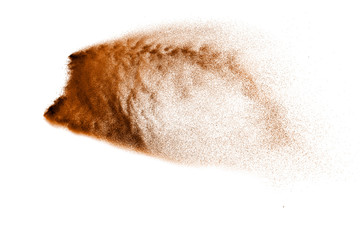 Dry river sand explosion. Brown color sand splash against white background.