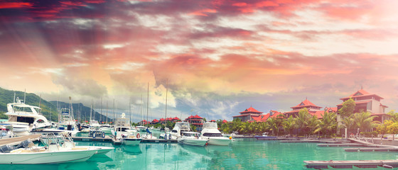 Beautiful Island port with boats and homes. Panoramic view at sunset. Eden Island
