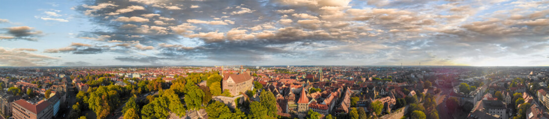 Nuremberg cityscape aerial view from city castle on a beautiful sunset - obrazy, fototapety, plakaty