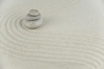 Crédence de cuisine en verre imprimé Pierres dans le sable Zen garden. Pyramids of white and gray zen stones on the white sand with abstract wave drawings. Concept of harmony, balance and meditation, spa, massage, relax.