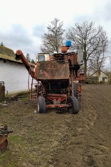 Obraz premium Harvester on farm in rural countryside