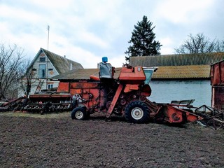 Fototapeta premium Harvester on farm in rural countryside