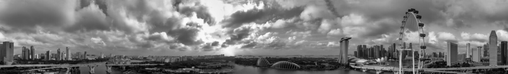 Black and white panoramic aerial view of Singapore skyline from a drone point of view