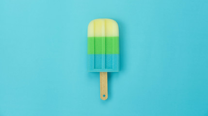 Table top view aerial image of sign or food of summer season holiday background concept.Flat lay of pastel sweet ice cream on modern rustic yellow paper backdrop.Minimalism and copy space design word.