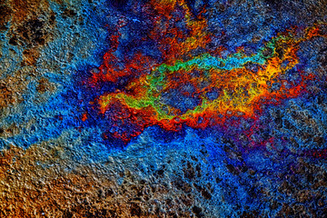 Oil stain on Asphalt road after rain