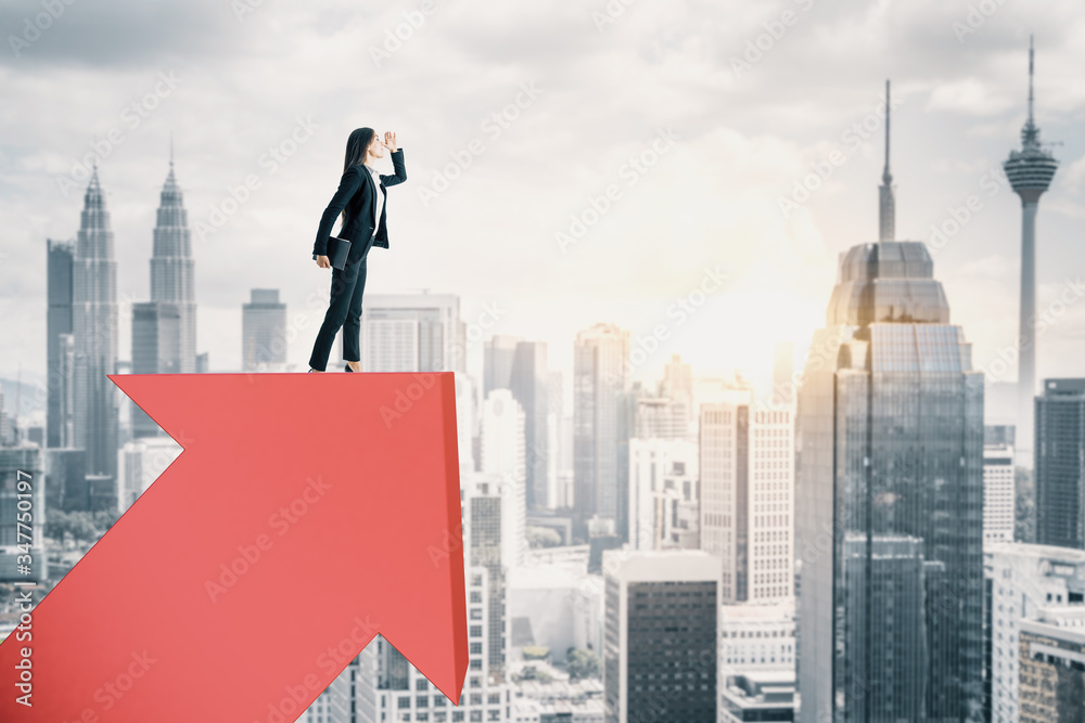 Wall mural businesswoman standing on red arrow