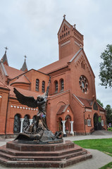 Catholic church of St. Simeon and St. Helena, also called the Red Church - the most famous Catholic church in Minsk. Bronze sculpture of the Archangel Michael - the patron saint of Belarus.
