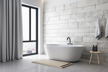 Obraz na płótnie Canvas Modern white bathroom with decorative objects and city viwe