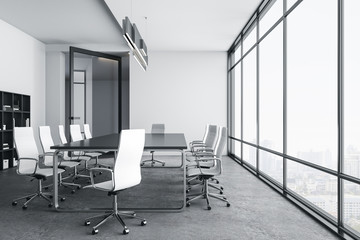 Bright conference room interior with city view.