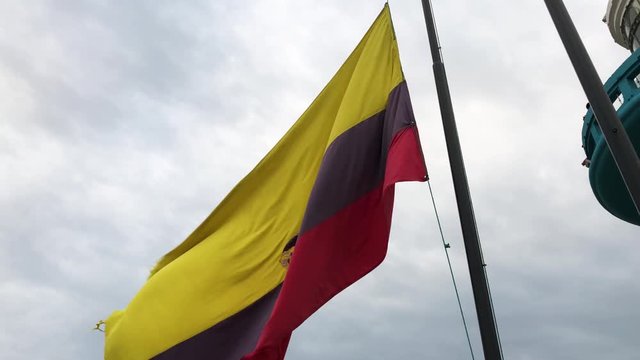 Lowering of the flag of ecuador in Las Peñas, Guayaquil. Lower the ecuador flag from the pole, next to the lighthouse in Las Peñas. Bajada de la bandera de Ecuador.