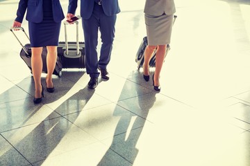Fototapeta na wymiar Cropped image of business people walking in airport 