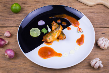 Spicy canned sardine salad and herbs