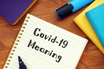 Health concept about covid meaning with sign on the page.