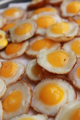 fried quail eggs in a frying pan