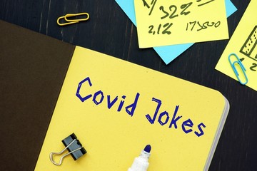 Health concept meaning covid jokes with sign on the piece of paper.
