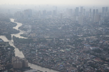 View of the cloudy air pollution flying over Manila, Philippines causing cloudy vision.