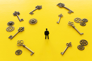 concept image of person looking at many keys trying to choose the right one