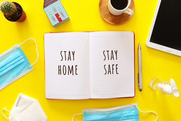 Covid 19 work from home background concept. top view notebook on home office coronavirus outbreak.