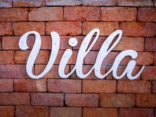 Villa on old red brick wall texture background