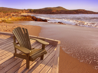 Chair on a deck overlooking Pacific ocean 