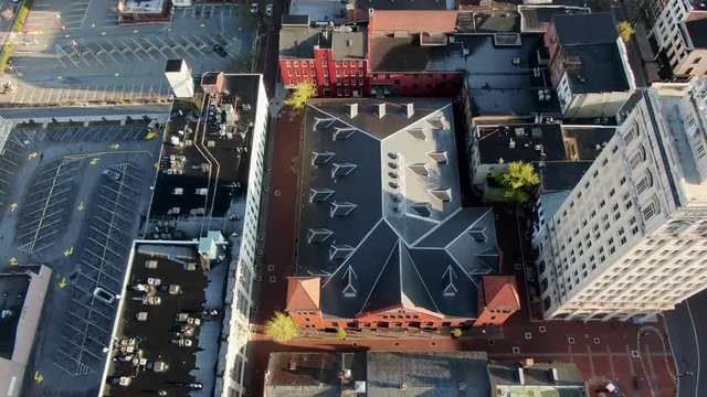 Dramatic aerial top-down shot of city buildings and skyscraper during COVID lockdown, quarantine, shelter in place