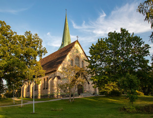 Fototapeta na wymiar Stone church in Gustavsberg on a summer day against a blue sky