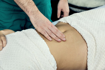 Obraz na płótnie Canvas Hands of a masseur's man doing a massage