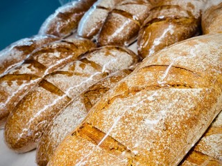 Fresh bread, rolls, cookies and other pastries. A close-up. Supermarket. Mobile photo.