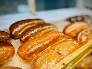 Fresh bread, rolls, cookies and other pastries. A close-up. Supermarket. Mobile photo.