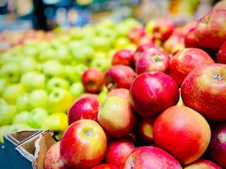 Oranges and apples. A close-up. Mobile photo. Supermarket.