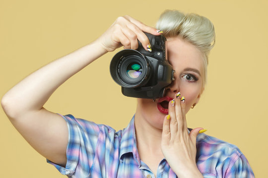 A photo of the pin-up girl with a photo camera