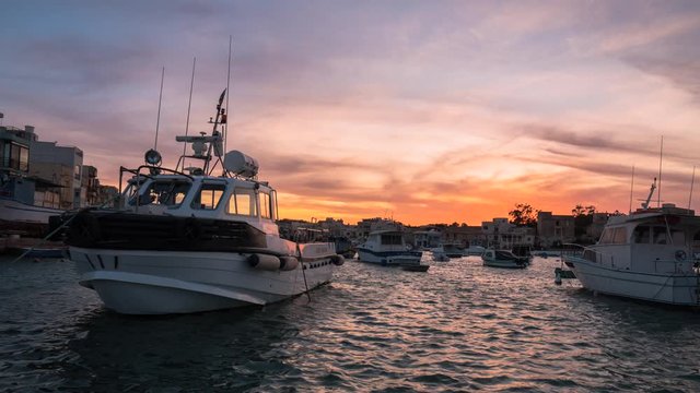 Beautiful Sunset Timealpse Overlooking Birzebbuga Malta With Vibrant Red and Orange Sky