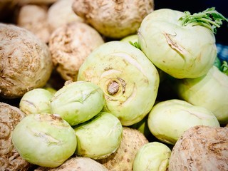 Greens, mushrooms and different vegetables. Photo in the supermarket on mobile.