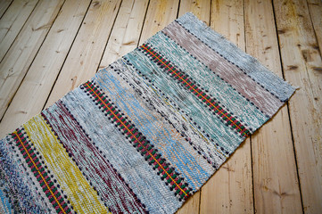 old woven mat on old wooden floor