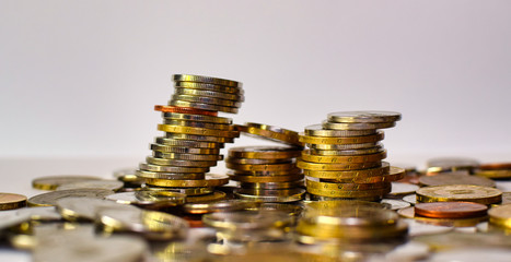 stack of coins on a white background