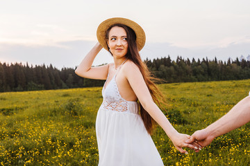 Young pregnant woman in the field.