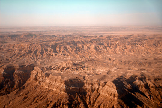 Photo of desert from the plane. View from above.  Situational plan with desert landscape.