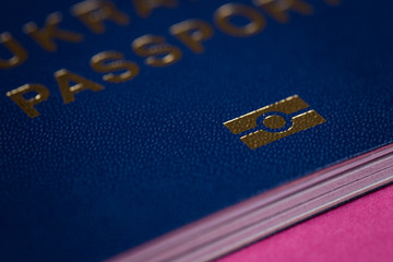 Blue biometric passport closeup. Biometrics sign shot on macro.