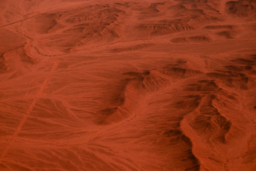 Photo of desert from the plane. View from above.  Situational plan with alien landscape. © Sunnyside