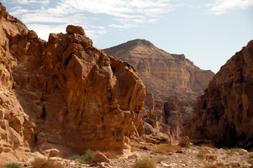 Fototapeta na wymiar Red canyon, Israel - December, 2019. Desert landscape near Eilat with rocks in the afternoon.