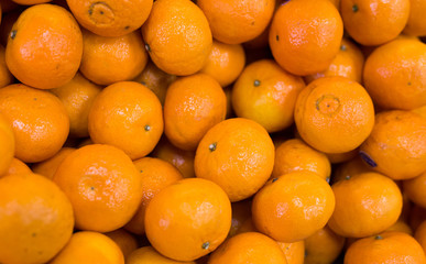 apetitic juicy farm mandarins at market counter