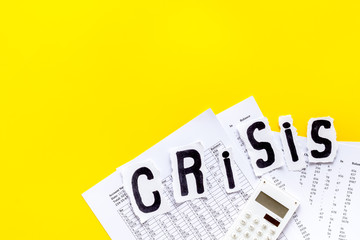 World financial crisis concept - documents, calculator - on yellow background top view copy space