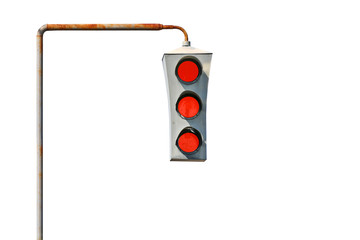 Isolated Vintage old traffic light on a rusty post. All lights are red. The concept of prohibition...