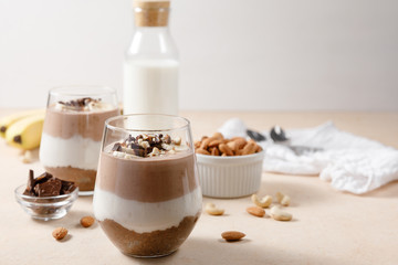 Chia seeds pudding with chocolate and banana smoothie in a glass