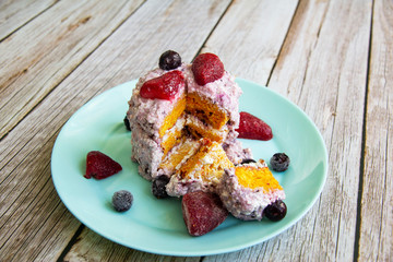 Carrot cake with curd cream, strawberries and currants